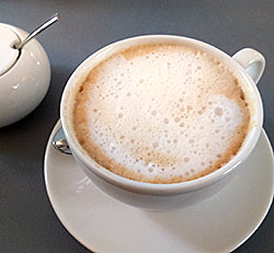 mela Cafe- Tasse Kaffee